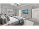 Staged bedroom featuring tray ceilings, furniture, and artwork at 6509 Sunset Manor Dr, Wake Forest, NC 27587