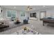Living area with stylish decor, including sofas, chairs, and entertainment options at 6509 Sunset Manor Dr, Wake Forest, NC 27587