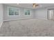 Large room with carpet and natural light, perfect for a flexible living space at 6509 Sunset Manor Dr, Wake Forest, NC 27587