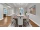 Elegant dining room features a coffered ceiling, chandelier, and ample seating for formal gatherings at 6509 Sunset Manor Dr, Wake Forest, NC 27587