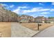 Spacious two-story home with long drive, stone accents, and manicured lawn at 6509 Sunset Manor Dr, Wake Forest, NC 27587