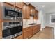 Stainless steel appliances, including a built-in oven, microwave, and a cooktop at 6509 Sunset Manor Dr, Wake Forest, NC 27587