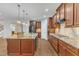 Kitchen features a large island, stainless steel appliances, and hardwood floors at 6509 Sunset Manor Dr, Wake Forest, NC 27587