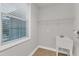 Well-lit laundry room with a window, sink, and wire shelving at 6509 Sunset Manor Dr, Wake Forest, NC 27587