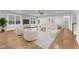 Bright, modern living room with hardwood floors, a ceiling fan, and an open floor plan at 6509 Sunset Manor Dr, Wake Forest, NC 27587