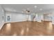 Open concept living room features hardwood floors, recessed lighting, and a ceiling fan at 6509 Sunset Manor Dr, Wake Forest, NC 27587