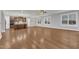 Bright living area boasts hardwood floors, recessed lighting, and a view of the modern kitchen at 6509 Sunset Manor Dr, Wake Forest, NC 27587