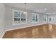 Living space featuring hardwood floors, recessed lighting, and several large windows for ample sunlight at 6509 Sunset Manor Dr, Wake Forest, NC 27587