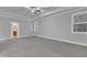 Main bedroom featuring carpeted floors, tray ceiling, and great natural light at 6509 Sunset Manor Dr, Wake Forest, NC 27587