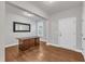 Well-lit home office features hardwood floors, a large window, and ample space for a desk and storage at 6509 Sunset Manor Dr, Wake Forest, NC 27587