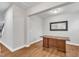 Open office space offers hardwood floors, neutral walls, and plenty of room for a desk or workstation at 6509 Sunset Manor Dr, Wake Forest, NC 27587