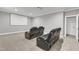 Bright theater room with large screen and comfortable seating, perfect for entertaining at 6509 Sunset Manor Dr, Wake Forest, NC 27587