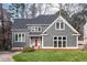 Charming home with a well-manicured lawn and a striking red front door at 6617 Tealbriar Dr, Raleigh, NC 27615