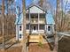 Inviting exterior featuring a metal roof, and a welcoming wooden porch at 6817 Ramblewood Dr, Hillsborough, NC 27278