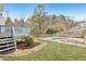 Backyard with a deck, stone patio and walkway offering ample space for outdoor living at 8409 Astwell Ct, Raleigh, NC 27615
