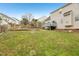 Expansive backyard featuring a patio area, lush lawn, and potential for outdoor activities at 8409 Astwell Ct, Raleigh, NC 27615