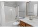 Bathroom featuring a shower and bathtub combination with single sink vanity at 8409 Astwell Ct, Raleigh, NC 27615