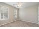 Neutral bedroom with two windows allowing natural light at 8409 Astwell Ct, Raleigh, NC 27615