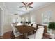 Virtual staging of a dining room with wood floors, mirrored wall, table, and chairs at 8409 Astwell Ct, Raleigh, NC 27615