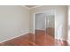 Open-concept floor plan with gleaming hardwood floors and views to the dining room at 8409 Astwell Ct, Raleigh, NC 27615