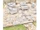 An outdoor patio features stone pavers and contemporary outdoor furniture, perfect for relaxing and enjoying the outdoors at 8409 Astwell Ct, Raleigh, NC 27615