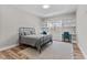 Charming bedroom featuring built-in bookshelves and a window seat, perfect for relaxation and productivity at 8528 Mangum Hollow Dr, Wake Forest, NC 27587