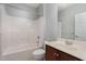 Clean bathroom with a shower-tub combo, white tile, and vanity with sink at 9221 Calabria Dr # 116, Raleigh, NC 27617