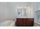 Bathroom with double sinks, and a tub at 9221 Calabria Dr # 116, Raleigh, NC 27617