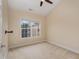 Cozy carpeted bedroom featuring a window offering lots of natural light and neutral color scheme at 9221 Calabria Dr # 116, Raleigh, NC 27617