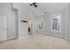 Spacious bedroom with carpet, a ceiling fan, and two large windows at 9221 Calabria Dr # 116, Raleigh, NC 27617
