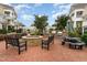 Outdoor common area with a fire pit, grill, picnic table, and seating for residents to enjoy at 9221 Calabria Dr # 116, Raleigh, NC 27617