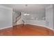 Dining area featuring hardwood floors, modern chandelier, and staircase at 9221 Calabria Dr # 116, Raleigh, NC 27617