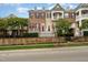 Charming townhome featuring a combination of brick and siding, and a well-manicured front yard at 9221 Calabria Dr # 116, Raleigh, NC 27617
