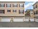 Attached garages for townhome residences, showcasing white doors and well-lit spaces at 9221 Calabria Dr # 116, Raleigh, NC 27617