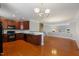 Open kitchen with stainless steel appliances and wood cabinets at 9221 Calabria Dr # 116, Raleigh, NC 27617