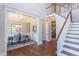 Stunning foyer leading to dining room and staircase, showcasing hardwood floors and great flow at 9517 Wood River Dr, Zebulon, NC 27597