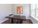 Bright office space featuring a large desk, natural light, and modern decor at 9517 Wood River Dr, Zebulon, NC 27597