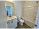 A bathroom with a toilet, tub, shower, and vanity at 100 N Stonemill Trl # Homesite 252, Wilson's Mills, NC 27520