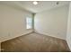 A carpeted bedroom with white walls has one window that lets in natural light at 100 N Stonemill Trl # Homesite 252, Wilson's Mills, NC 27520