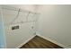 A laundry room with vinyl floor and wire shelving at 100 N Stonemill Trl # Homesite 252, Wilson's Mills, NC 27520