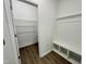 Mudroom offers convenient storage with bench seating and an adjacent shelved pantry at 100 N Stonemill Trl # Homesite 252, Wilson's Mills, NC 27520