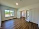 Office space with wood floors and large window, complemented by glass panel double doors at 100 N Stonemill Trl # Homesite 252, Wilson's Mills, NC 27520