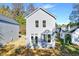 Newly built two-story home with gray siding and modern windows against a grassy background at 102 Woodson St, Oxford, NC 27565