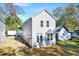 Newly built two-story home with gray siding and modern windows against a grassy background at 102 Woodson St, Oxford, NC 27565