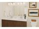A bathroom with double sinks, modern fixtures, and neutral tones provides a bright, clean space at 104 N Stonemill Trl # Homesite 253, Clayton, NC 27520