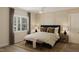 Serene bedroom featuring soft lighting, a comfortable bed, and stylish decor, creating a relaxing retreat at 104 N Stonemill Trl # Homesite 253, Clayton, NC 27520