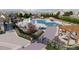 Rendering of resort-style community pool and play area with lounge seating at 104 N Stonemill Trl # Homesite 253, Clayton, NC 27520