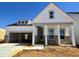 New construction home featuring a covered entryway with columns and an attached two car garage at 104 N Stonemill Trl # Homesite 253, Clayton, NC 27520