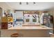 Functional kitchen with ample counter space, a cozy breakfast bar, and open shelving at 107 Hillview St, Carrboro, NC 27510