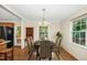 Dining area featuring a round table, seating for six, an area rug, and natural light from a window at 1105 Manchester Dr, Cary, NC 27511